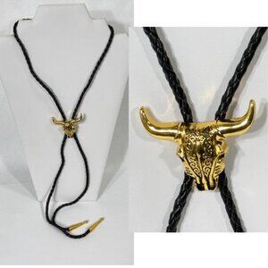 Gold-tone bull skull and black cord western cowboy bolo tie